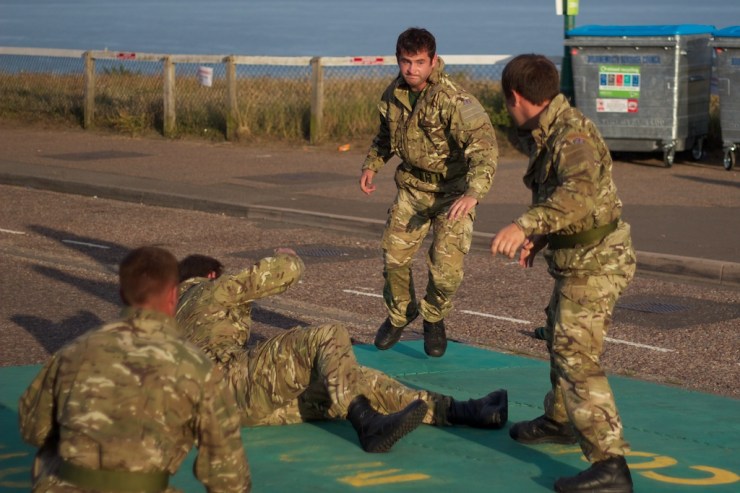 This was actually apparently showing how one guy could defend himself against three within the confines of a safety mat.