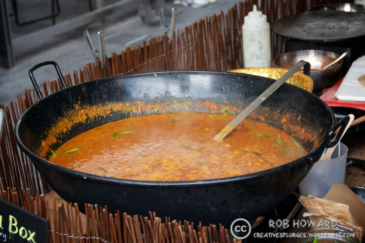 vat of curry at a market stall