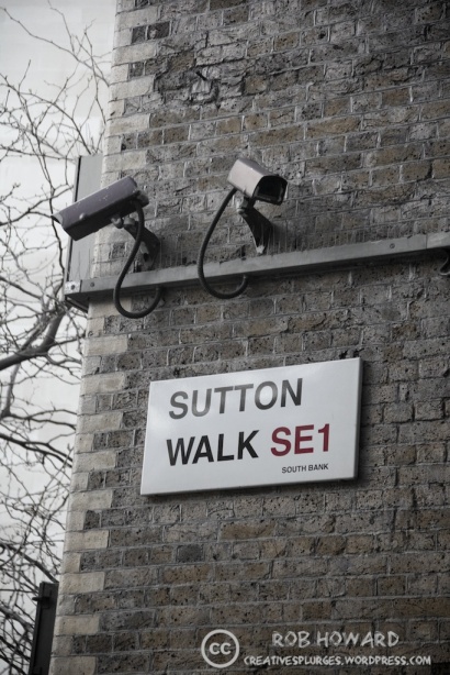 two security cameras by a London street sign