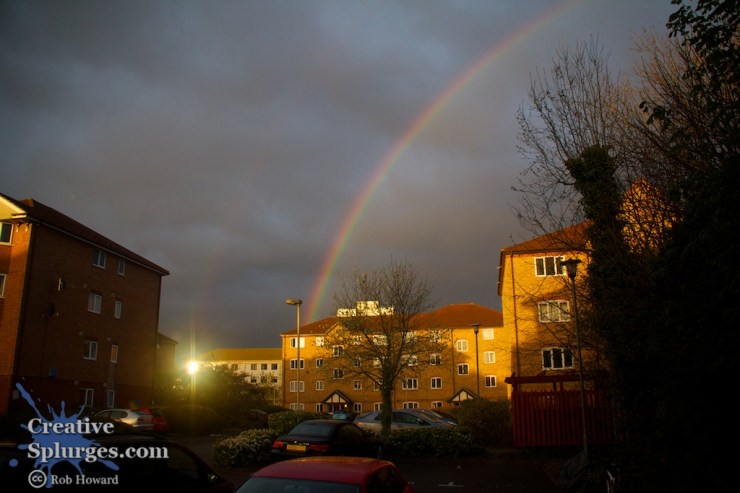 rainbow over houses