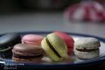 close up of colourful macaroons on a plate