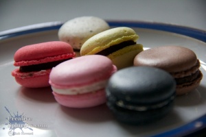 coloured macaroons on a plate