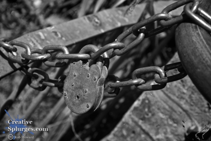 monochrome closeup of a padlock and chain