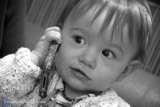 "Hello? Yes, this is child." 1/25sec, f/5.6, ISO 640, exposure bias -0.67, 120mm