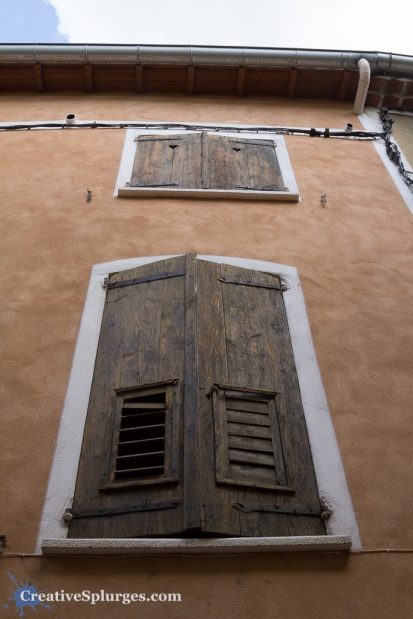 A set of windows in a building in Moustiers-Sainte-Marie, France